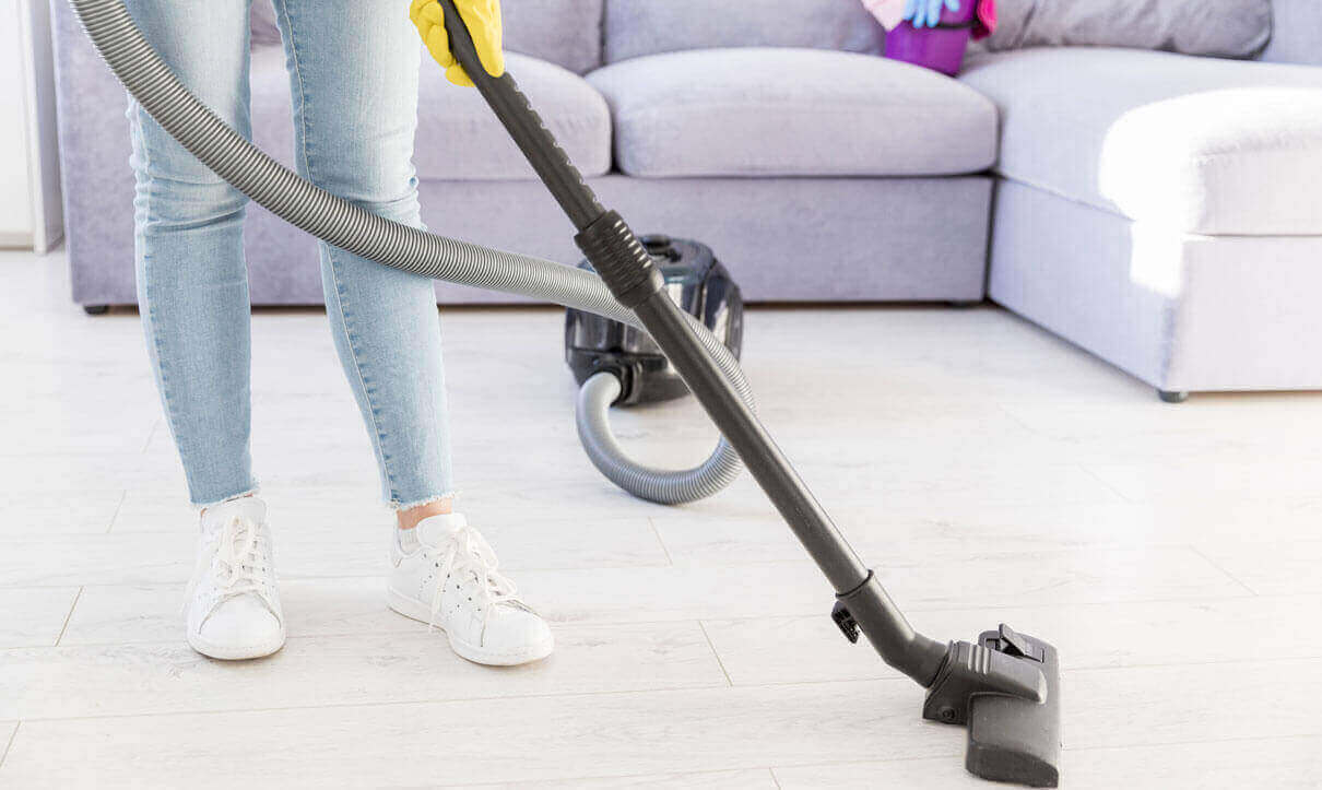 Person Vacuuming carpet