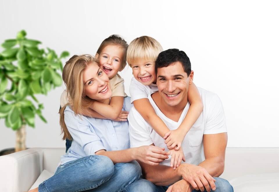 Happy family sitting on couch